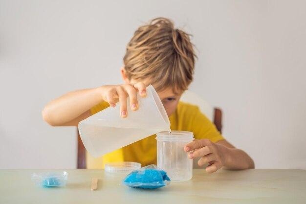 chemical home tests tools for the home lab the boy explorer child is watching a chemical reaction the young chemist doing scientific experiments physical experiment inside